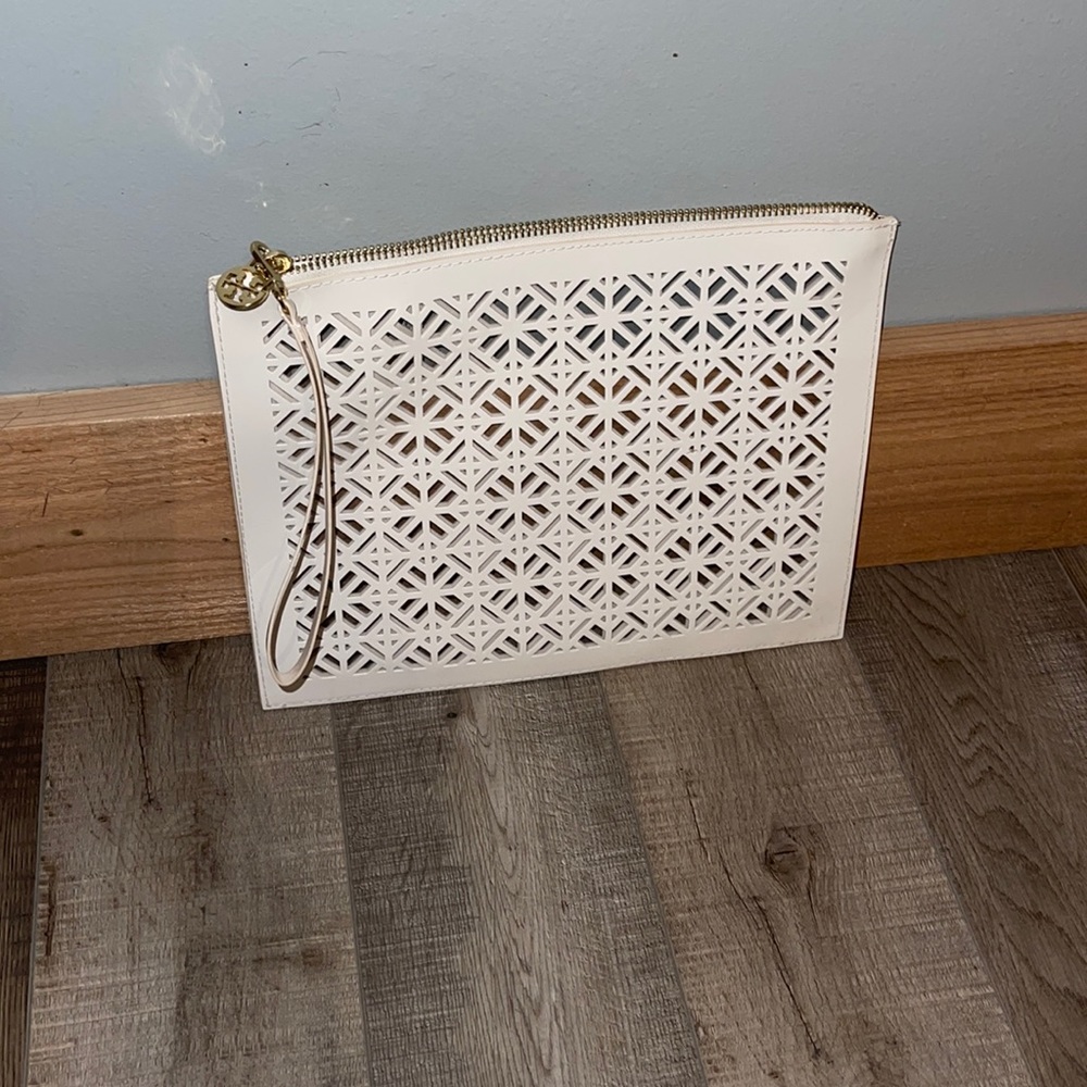 Tory Burch White clutch/wristlet. 11” W x 8.5” H x 4.5 opening.